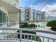 View of a luxurious pool and manicured grounds from a private balcony at a condominium complex at 100 S Eola Dr # 611, Orlando, FL 32801
