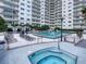 Inviting pool and spa area with ample lounge chairs, cabanas and lush landscaping at 100 S Eola Dr # 611, Orlando, FL 32801