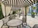 Cabana poolside seating area with tables and chairs, providing a relaxing outdoor space near the pool at 100 S Eola Dr # 611, Orlando, FL 32801