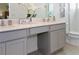 Bathroom featuring double sinks set in quartz countertops, providing ample space and a clean, stylish design at 10251 Ebb Tide Ln, Orlando, FL 32821