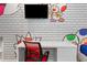Fun bedroom featuring a desk and flat screen, perfect for studying or gaming in a playful environment at 10251 Ebb Tide Ln, Orlando, FL 32821
