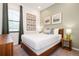Cozy bedroom featuring soft green walls, neutral decor, and natural light creating a serene and inviting space at 10251 Ebb Tide Ln, Orlando, FL 32821