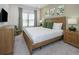 Relaxing bedroom featuring a comfortable bed, natural light, and soft decor, perfect for a restful night's sleep at 10251 Ebb Tide Ln, Orlando, FL 32821