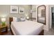Calm bedroom featuring neutral wall paint, a bed, a mirror reflecting the room, and a closet at 10251 Ebb Tide Ln, Orlando, FL 32821