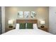 Inviting bedroom showcasing a bed with vibrant lamps, adding a touch of sophistication to the space at 10251 Ebb Tide Ln, Orlando, FL 32821