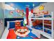 Themed ' bedroom featuring unique bedding and mural, complemented by a bunk bed and twin bed setup at 10251 Ebb Tide Ln, Orlando, FL 32821