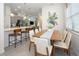 Bright dining area flows into the modern kitchen, perfect for entertaining guests and Gathering at 10251 Ebb Tide Ln, Orlando, FL 32821