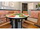 Enjoy a friendly game at this table with leather chairs, adding an element of fun and sophistication to the living space at 10251 Ebb Tide Ln, Orlando, FL 32821