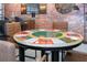 Poker table providing a touch of fun and sophistication to this versatile living space at 10251 Ebb Tide Ln, Orlando, FL 32821