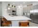 Well-lit kitchen with stainless steel appliances, grey cabinetry, and a spacious quartz countertop at 10251 Ebb Tide Ln, Orlando, FL 32821