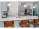 Bright kitchen featuring gray cabinets, stainless steel appliances, and a spacious quartz countertop island at 10251 Ebb Tide Ln, Orlando, FL 32821