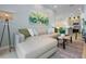 Open concept living room features a sectional sofa, stylish decor, and an adjacent kitchen area at 10251 Ebb Tide Ln, Orlando, FL 32821