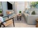 Modern living room featuring a comfortable sectional sofa, neutral decor, and access to the outdoors at 10251 Ebb Tide Ln, Orlando, FL 32821