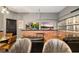 Recreational room featuring brick accent wall, lounge seating, and mounted televisions at 10251 Ebb Tide Ln, Orlando, FL 32821