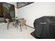Outdoor patio featuring a table, chairs, and grill for outdoor dining and entertaining at 10251 Ebb Tide Ln, Orlando, FL 32821