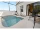 Outdoor pool area with lounge chairs and table with chairs, perfect for enjoying the Florida sunshine at 10251 Ebb Tide Ln, Orlando, FL 32821