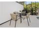 Outdoor patio with table, chairs, and barbecue near a pool, perfect for relaxing and entertaining at 10251 Ebb Tide Ln, Orlando, FL 32821