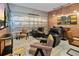 Recreational room featuring brick accent wall, lounge seating, and bar at 10251 Ebb Tide Ln, Orlando, FL 32821
