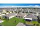 Aerial view showing a home and its location with a spacious backyard in a lively neighborhood at 1120 Saguaro St, Haines City, FL 33844