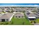 Aerial view of a home with solar panels, a large backyard, and seamless indoor-outdoor living at 1120 Saguaro St, Haines City, FL 33844
