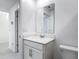 Bathroom with modern sink, cabinets, and light-colored tile at 1120 Saguaro St, Haines City, FL 33844