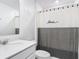 Bathroom featuring a white countertop sink, a modern shower curtain, and neutral colors at 1120 Saguaro St, Haines City, FL 33844
