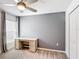 Neutral-colored room with a desk next to a window and a ceiling fan at 1120 Saguaro St, Haines City, FL 33844