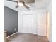 Neutral-colored bedroom with a large closet and ceiling fan at 1120 Saguaro St, Haines City, FL 33844