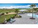 Resort style community pool featuring ample seating and lush landscaping, perfect for relaxing and soaking up the sun at 1120 Saguaro St, Haines City, FL 33844