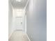 Bright hallway with tile flooring, crown molding, and elegant lighting fixtures leading to front door at 1120 Saguaro St, Haines City, FL 33844
