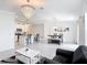 Open-concept living area seamlessly connecting the kitchen, dining area, and living room at 1120 Saguaro St, Haines City, FL 33844