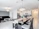 Spacious living space with modern furnishings connecting kitchen, dining, and living areas at 1120 Saguaro St, Haines City, FL 33844