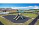 Community playground featuring slides, swings, and a covered seating area for Gathering fun and enjoyment at 1120 Saguaro St, Haines City, FL 33844