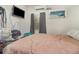 Cozy bedroom featuring a window with blinds and a tan comforter on the bed in the home at 11509 Cameron St, Orlando, FL 32817