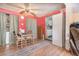 A cozy dining area with a wood table and chairs, plus a rug on hardwood floors in this home at 11509 Cameron St, Orlando, FL 32817