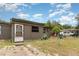 A single-story house with a small front yard and decorative lawn ornaments at 11509 Cameron St, Orlando, FL 32817