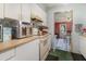 Efficient kitchen space with white appliances and cabinets at 11509 Cameron St, Orlando, FL 32817