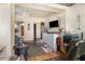 Cozy living room with hardwood floors and an entertainment area featuring a TV and printer at 11509 Cameron St, Orlando, FL 32817