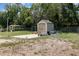Backyard shed for extra storage space with ample room and a convenient concrete pad for easy access and functionality at 11509 Cameron St, Orlando, FL 32817