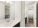 Clean bathroom featuring a white vanity and open doorway to an adjoining bathroom with shower at 11707 Hampstead St, Windermere, FL 34786