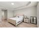 Cozy bedroom with a large bed, wood floors, and a window offering natural light and a serene atmosphere at 11707 Hampstead St, Windermere, FL 34786