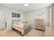 Well lit bedroom with hardwood floors, neutral color palette, and charming decorations at 11707 Hampstead St, Windermere, FL 34786
