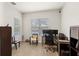Bright home office with wood floors, a large window, and a minimalist design for a comfortable workspace at 11707 Hampstead St, Windermere, FL 34786