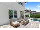 Inviting outdoor patio with comfortable seating and modern fire pit, perfect for relaxation and entertaining at 11707 Hampstead St, Windermere, FL 34786