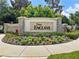 The Enclave community sign surrounded by lush landscaping, marking the entrance of the neighborhood at 11707 Hampstead St, Windermere, FL 34786