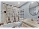 Clean bathroom with a vanity, toilet, and a Paris-themed shower curtain at 1216 Floral Way, Apopka, FL 32703