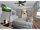 Relaxing bedroom featuring a TV, dresser, and neutral color scheme at 1216 Floral Way, Apopka, FL 32703