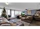 Inviting living room with a Christmas tree and ample seating at 1216 Floral Way, Apopka, FL 32703