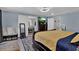 Spacious main bedroom featuring a comfortable bed, stylish furniture, and tranquil decor at 1216 Floral Way, Apopka, FL 32703