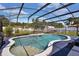 Inviting pool in a screened enclosure, perfect for outdoor relaxation and backyard entertaining at 1216 Floral Way, Apopka, FL 32703